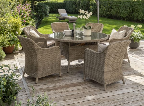 0195530 6009 0195536 6009 PFR30 927 Charlbury 6 seat dining set lifestyle with 3m round free arm parasol tilted lounger in background LIFESTYLE scaled 2 e1719225397607